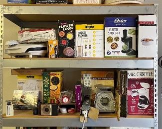 Lots of appliances still in boxes. Never used.  Small kitchen scales, cookie press with attachments, toaster oven, coffee maker, quesadilla maker, Foreman grill, veggie spiral slicer, electric knives, and more.