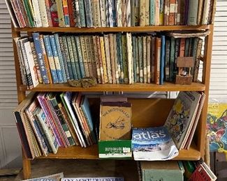 Children's books. Many are from the local school or were adopted when the library discarded them. Some date to the 1940s.  Some are textbooks or old teacher curricula.  Many more still in boxes.  Some have damaged bindings, but the illustrations are beautiful for framing.
