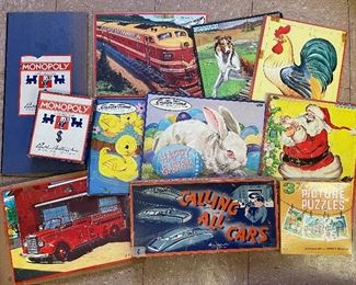 Vintage board games and puzzles.  More stacked in boxes.