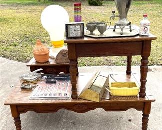 Coffee table +2 matching end tables, White light bulb lamp from the 70s, alarm clock, aluminum tumblers, coffee service, solid brass mailbox, set of wrenches, tortilla press, curtain tiebacks, terracotta casserole