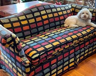 Super colorful camel back small sofa. Buster is not for sale!
