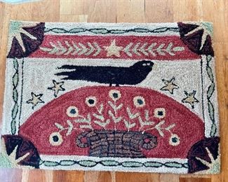 Newer hooked rug with old crow.