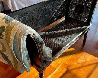 Antique, black, caned settee. Excellent antique condition.