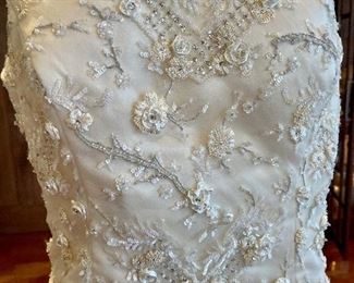 Dress was cleaned and archival packed. No stains or damage.