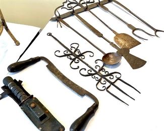 Hand-forged early kitchen utensils on hanging rack with hand cut square nails - SOLD, antique cut saw, vintage knife in sheath.