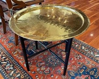 Brass table on folding black lacquer legs