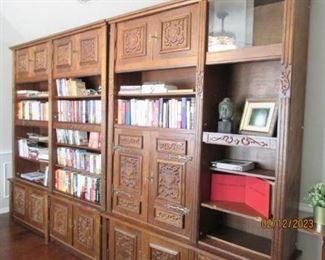 4 unit bookcase.  Ornate trim.  2 glass doors for each cabinet.  Approx. 7' tall.  Good condition.  Needs some repairs. 