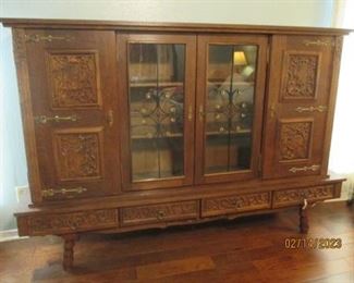 Beautiful Antique Display Cabinet.  Glass doors, ornate trim, 4 drawers along bottom, 6 shelves behind doors.  From Romania.   Needs love....it's been sitting pretty for a long time.  