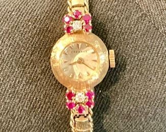 14kt with diamonds and rubies. Security on premises. Valuables removed daily. 