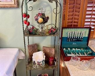 Metal arched display shelf.