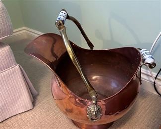 Copper coal scuttle with delft handles.