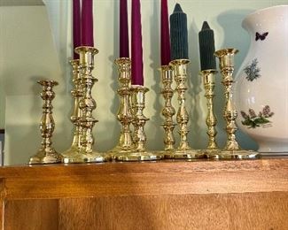 Collection of polished Baldwin brass candlesticks.