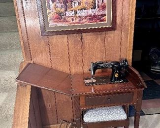Vintage electric singer sewing machine, table and bench.