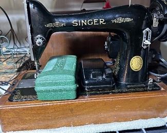 Second Singer sewing machine in portable case.