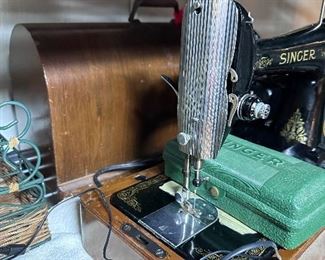 Another antique electric singer sewing machine in case.