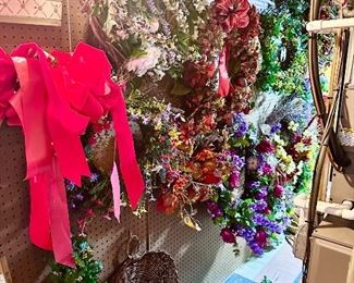 A large selection of silk flower wreaths.