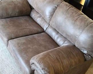 Ashley Faux Leather Loveseat