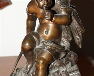 Cast iron cherub sculpture
