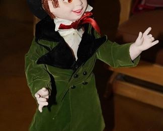 This little vintage/semi-antique Christmas caroler or leprechaun stands about 3ft tall