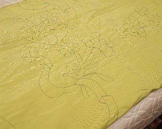 There are several custom woven linens and bed covers for sale. 