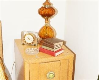 Note the super cool vintage amber glass double globe table lamp-we have two!  oh, and the great lucite desk clock-welcome to the 1950's. 