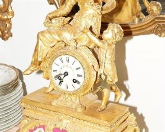 Figural gold gilt with porcelain mantle clock