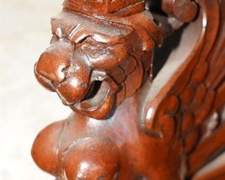 The griffin carving extends back down the chair-super cool!
