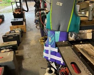 Fishing pole, life jackets, worms and tackle boxes