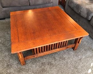 38" square wood Arts & Crafts style coffee table with matching side table shown with sofas