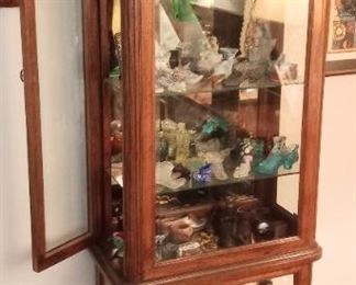 Curio cabinet with vintage shoe collection