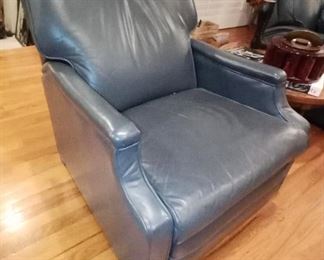 Very unique Mid Century leather reclining chair, circa 1960's. Looks like a lovely leather chair, but when opened, a leg rest AND head rest appears...