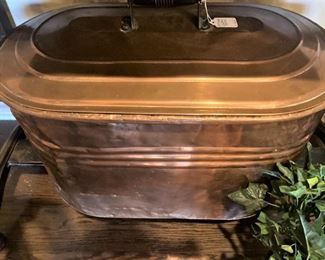 Large antique copper tub with lid