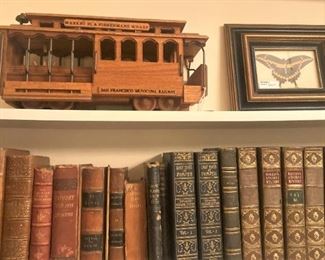 Old books; trolley; framed butterfly
