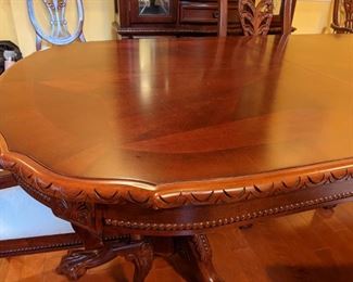 Beautiful 90" long dining Table with Leaves Includes 6 chairs.  Arm on one of the chairs is loose