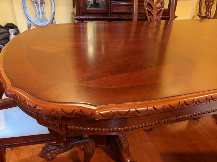 Beautiful 90" long dining Table with Leaves Includes 6 chairs.  Arm on one of the chairs is loose