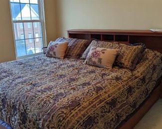 Queen Bed with storage drawers below mattress included.  (Bedding not included.)