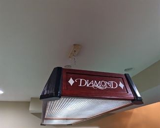 Light 102" long and 26" wide 8.5" high sold separate from pool table.