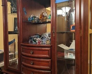 55" wide 18"Deep 81" high, class has a crack on the side.