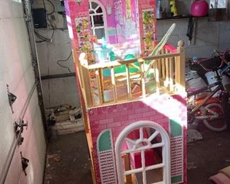 large doll playhouse and there are toys as well