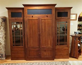 One of two large Ethan Allan entertainment centers