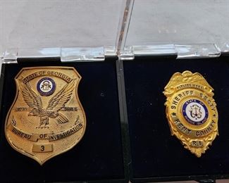 Left: Georgia Bureau of Investigation (GBI) prototype badge, brass color with dap.    Right: Kent County Rhode Island Sheriff Secty badge.                                                              