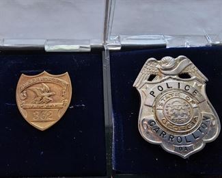 Left: National Defense Council Deputy badge. Right:  Carrollton GA Police badge.