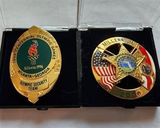 Left: 1996 Olympic Security Team badge. Right:  Broward County, FL Deputy Sheriff Millennium badge.