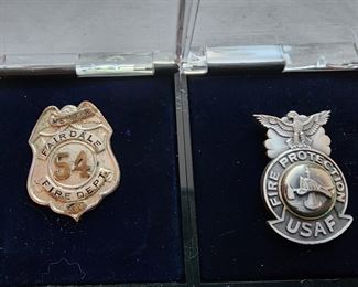 Left: Fairdale KY Fire Department member badge.  Right: USAF Fire Protection badge.