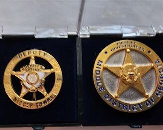 Left: Seminole Co GA Deputy Sheriff’s badge. Right: Middle District of Georgia Fugitive Investigator’s badge.
