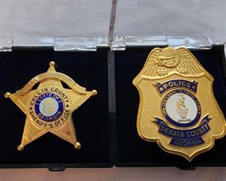 Left: Prototype badge Collin County SO. There is no Collin County, GA. Right: Dekalb County Police 1996 Olympic badge.