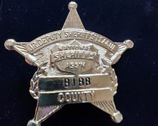 National Sheriff’s Association Junior Deputy Sheriff’s League badge for Bibb Co SO. These badges were given to young boys who registered their bicycles with the SO. This one includes registration paperwork.