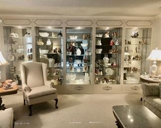 Sitting room of quality furniture and a display wall like no other 