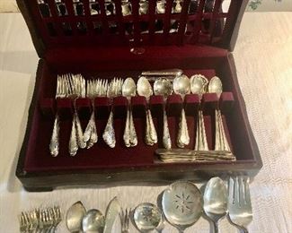 International “Enchantress “ Sterling flatware with serving pieces. 


