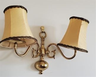 One of a pair of brass double wall sconces
